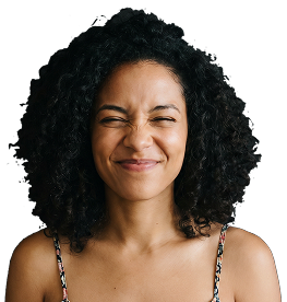 A contestant with curly hair laughing